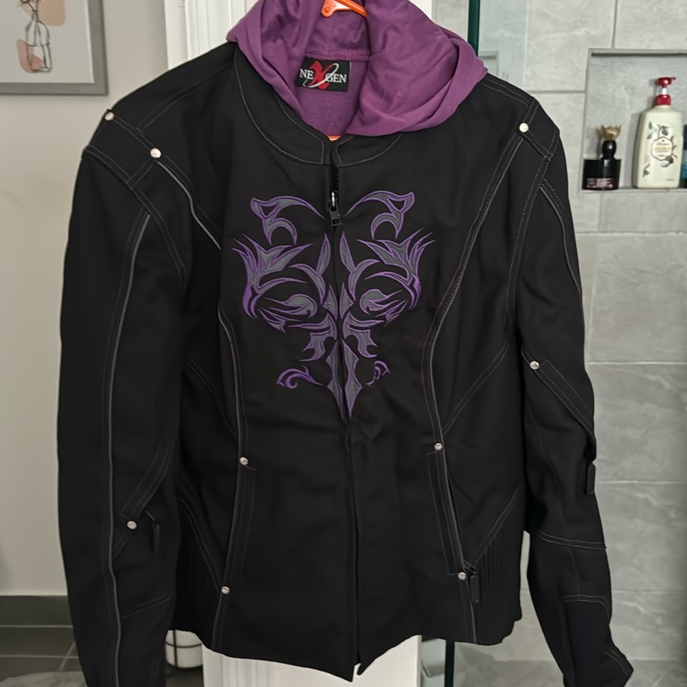 Women’s purple and black motorcycle jacket with removable liner.